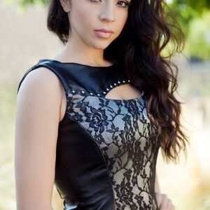 Edgy Black Lace Mini Dress With Silver Studs And Black Lace Inserts